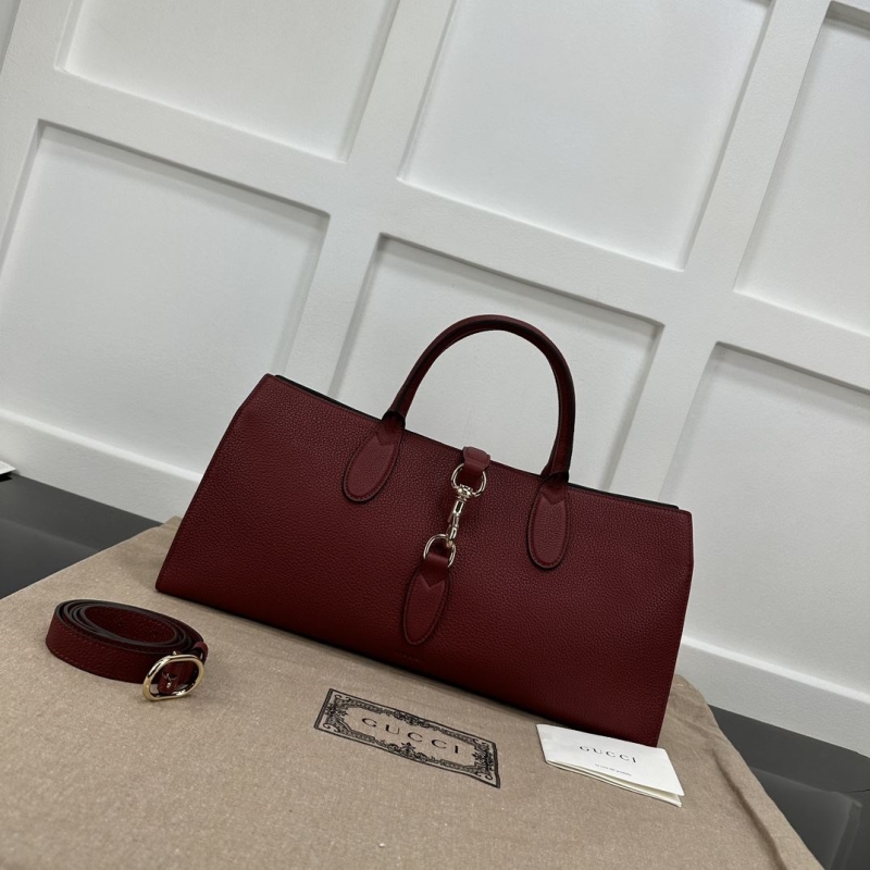 G*u*i top handle bags